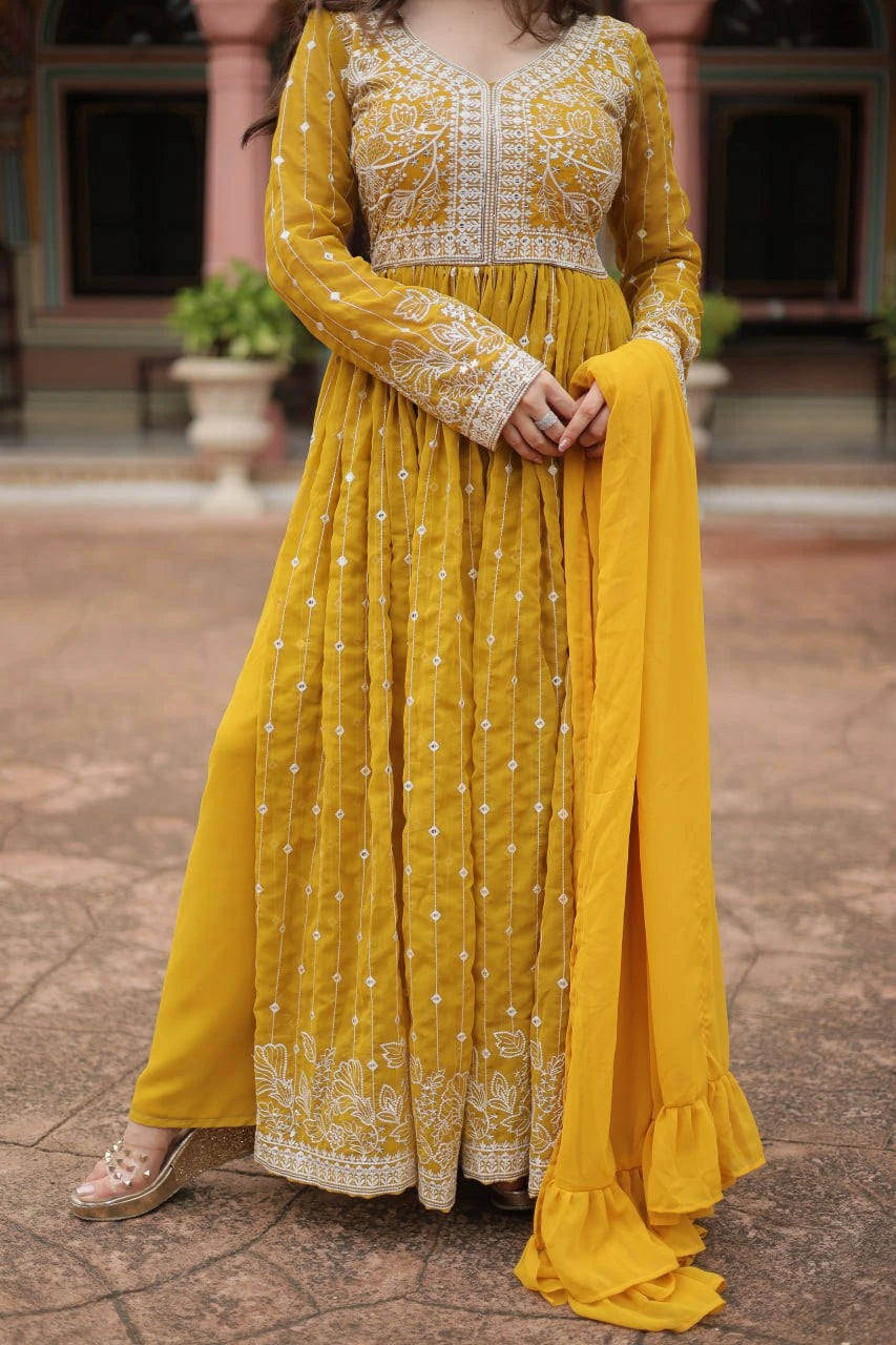 Yellow traditional outfit with white embroidery on a stone pavement background